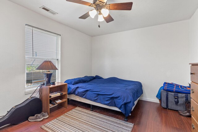 317 Hickory St, Merriam Woods, MO 65740 - bedroom featuring visible vents, ceiling fan, wood finished floors, and baseboards