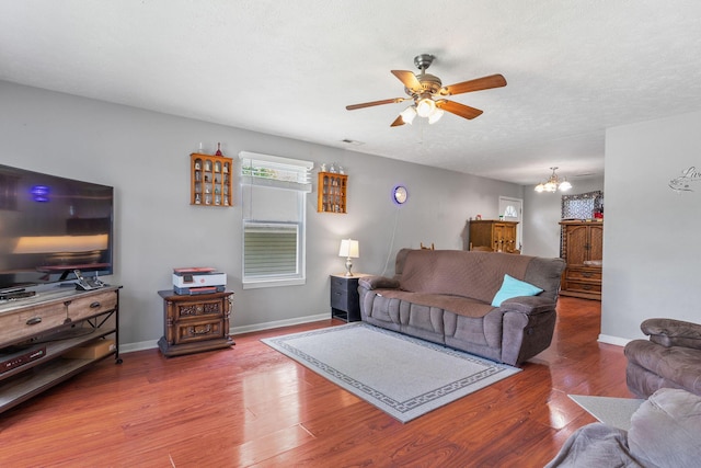 317 Hickory St, Merriam Woods, MO 65740 - living area featuring baseboards, wood finished floors, and ceiling fan with notable chandelier