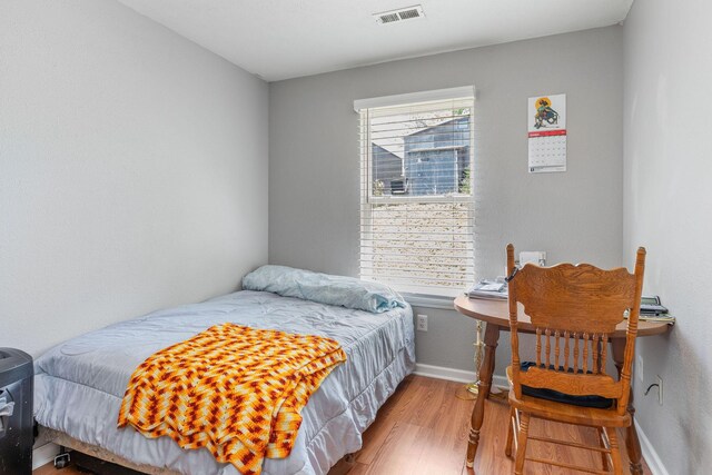 317 Hickory St, Merriam Woods, MO 65740 - bedroom with baseboards, visible vents, and wood finished floors