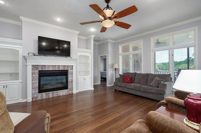 living area with wood finished floors, built in features, and ornamental molding