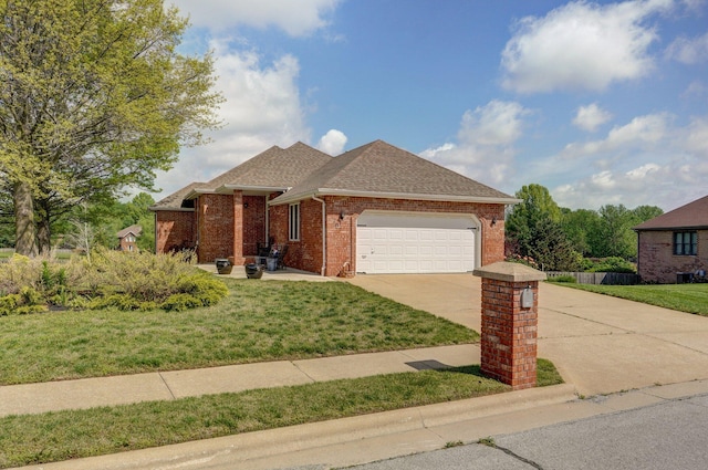ranch-style house featuring a front yard, a garage, a shingled roof, brick siding, and concrete driveway