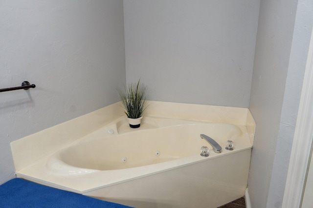 full bath with a tub with jets