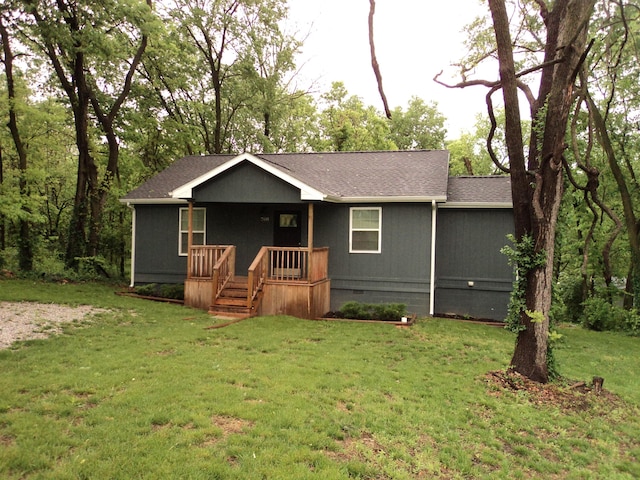 single story home with covered porch, crawl space, a front yard, and roof with shingles