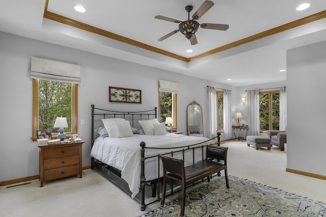 bedroom featuring recessed lighting, baseboards, light colored carpet, and a tray ceiling