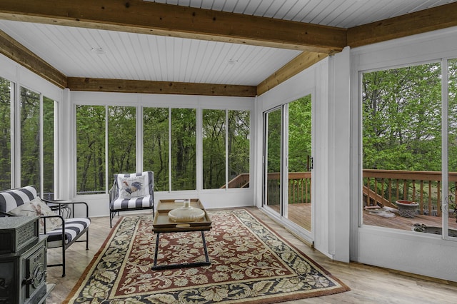 sunroom / solarium with an outdoor hangout area and beamed ceiling