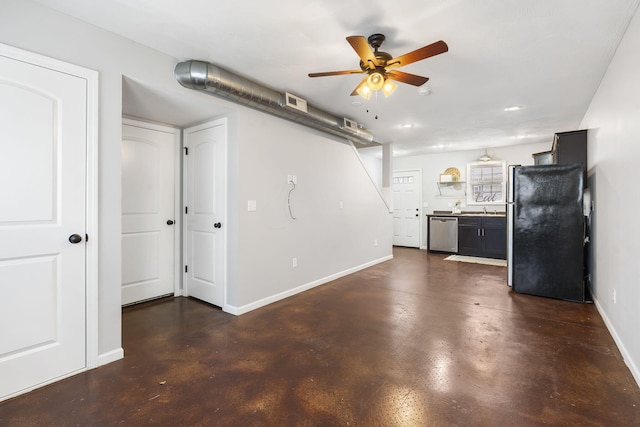 unfurnished living room with finished concrete floors, a sink, ceiling fan, baseboards, and recessed lighting