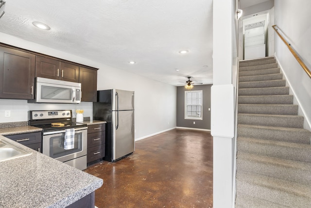 kitchen with recessed lighting, appliances with stainless steel finishes, ceiling fan, finished concrete flooring, and dark brown cabinets