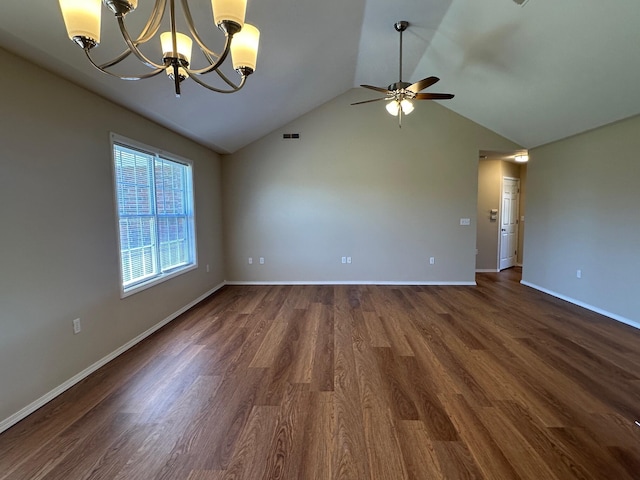 empty room with ceiling fan with notable chandelier, dark wood-style flooring, baseboards, visible vents, and lofted ceiling