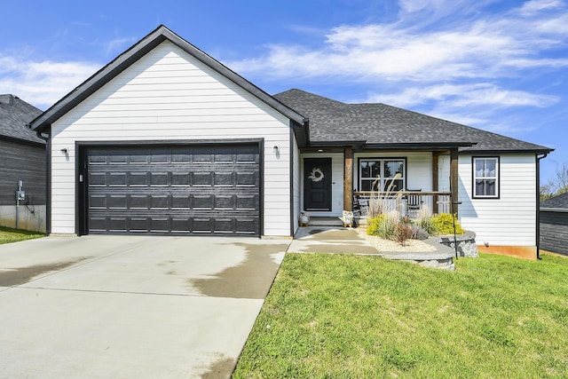 ranch-style home with covered porch, driveway, roof with shingles, a front yard, and an attached garage
