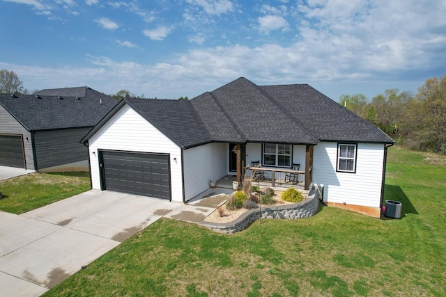 single story home featuring a porch, a front yard, a garage, central AC unit, and driveway