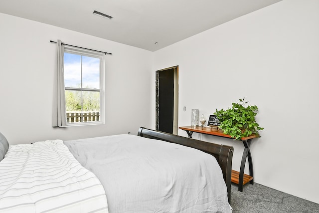 carpeted bedroom with visible vents