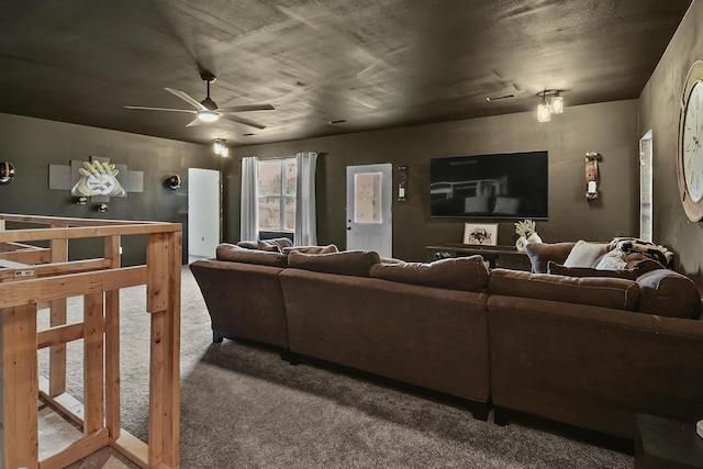 carpeted living area featuring ceiling fan
