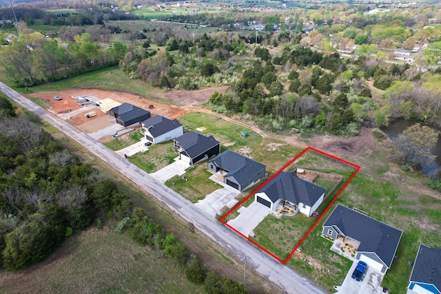 birds eye view of property with a residential view