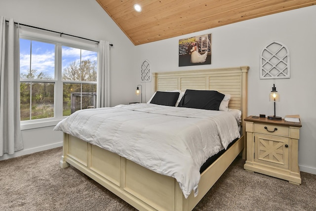bedroom featuring baseboards, multiple windows, dark carpet, and wood ceiling