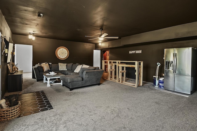 living room with a ceiling fan and carpet floors