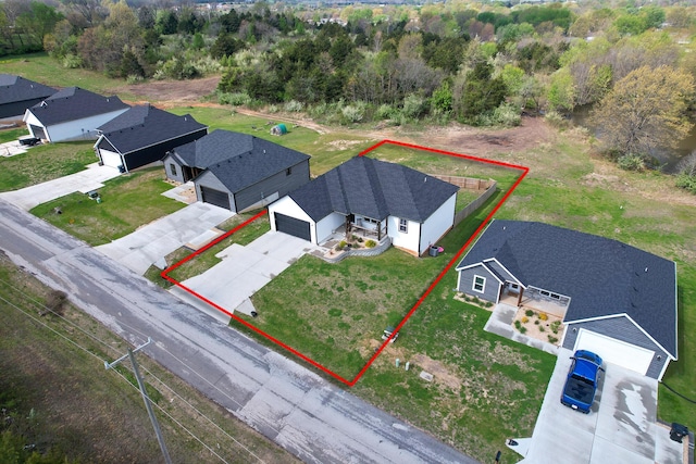 birds eye view of property with a residential view