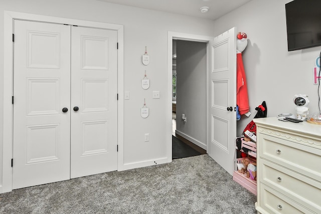 carpeted bedroom with a closet