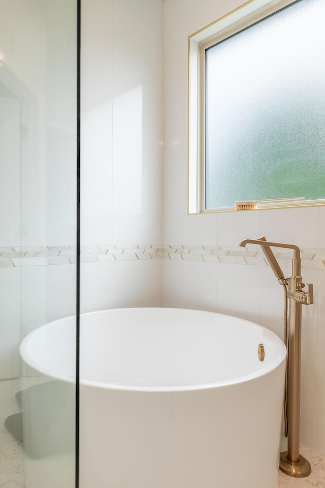 bathroom featuring a freestanding bath