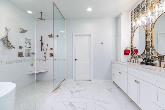 full bathroom with walk in shower, recessed lighting, a freestanding tub, vanity, and marble finish floor
