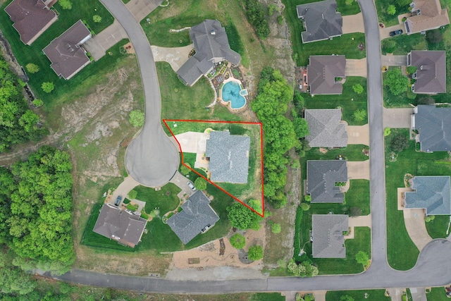 birds eye view of property with a residential view