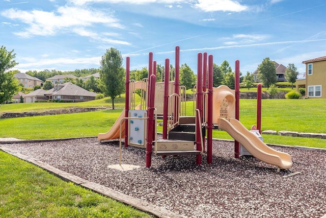 community play area featuring a residential view and a lawn