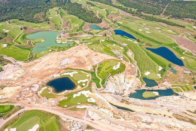 aerial view with a water view and view of golf course