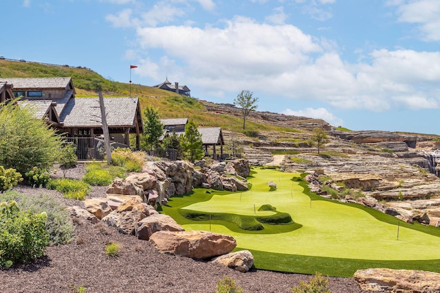 surrounding community featuring view of golf course