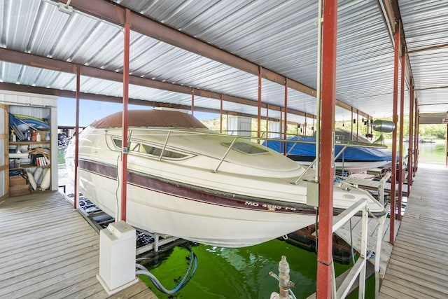 view of dock with boat lift