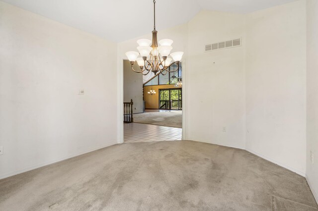 carpeted spare room featuring a chandelier, high vaulted ceiling, visible vents, and tile patterned flooring