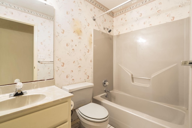 bathroom featuring toilet, wallpapered walls, vanity, and washtub / shower combination