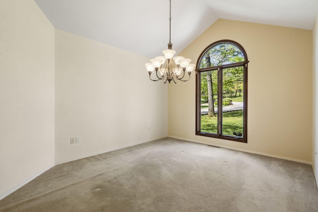 spare room featuring carpet floors, vaulted ceiling, baseboards, visible vents, and a notable chandelier