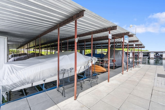 dock area featuring a water view and boat lift