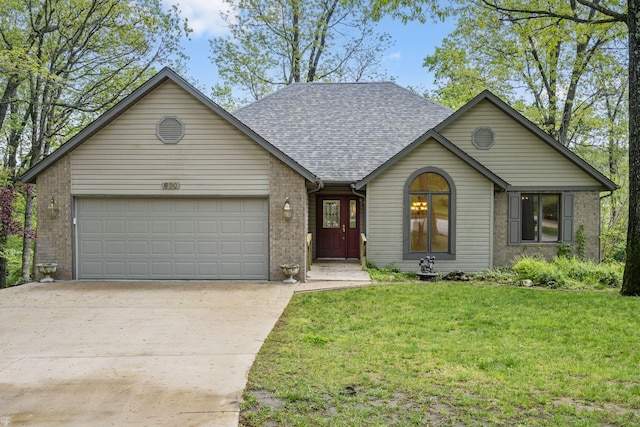 view of front of house with brick siding, a shingled roof, a front yard, concrete driveway, and an attached garage