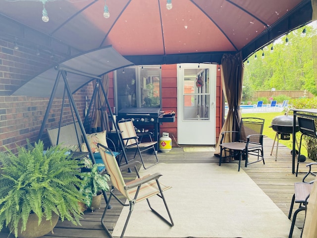 2949 State Highway Jj, Crane, MO 65633 - deck featuring a gazebo, a swimming pool, and fence