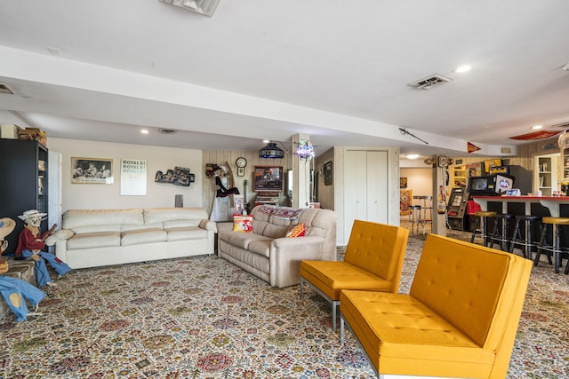 living area with visible vents and recessed lighting