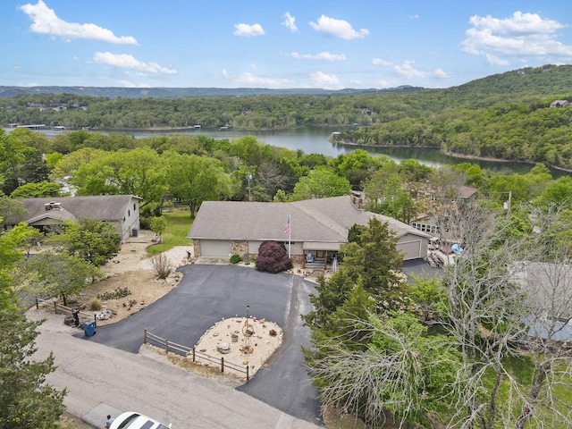 aerial view with a water view and a view of trees
