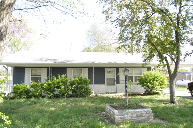 ranch-style house with a front yard