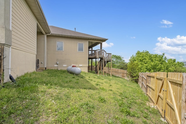 view of yard featuring a wooden deck and a fenced backyard