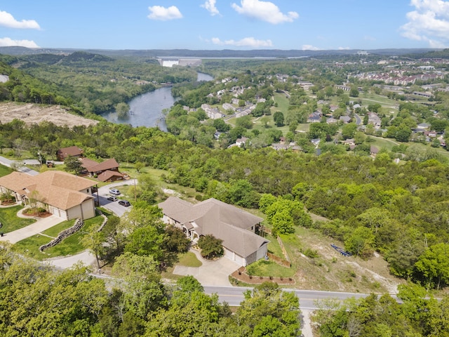 drone / aerial view featuring a residential view and a water view