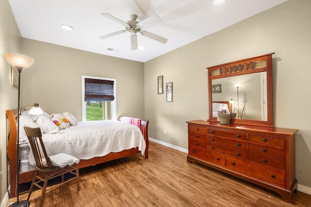 bedroom with visible vents, baseboards, recessed lighting, wood finished floors, and a ceiling fan