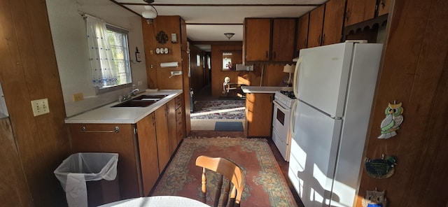 22684 Forest Ln, Hermitage, MO 65668 - kitchen with white appliances, a sink, light countertops, and brown cabinetry