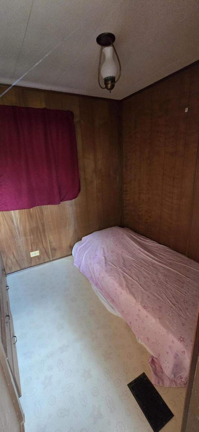 22684 Forest Ln, Hermitage, MO 65668 - carpeted bedroom with wooden walls