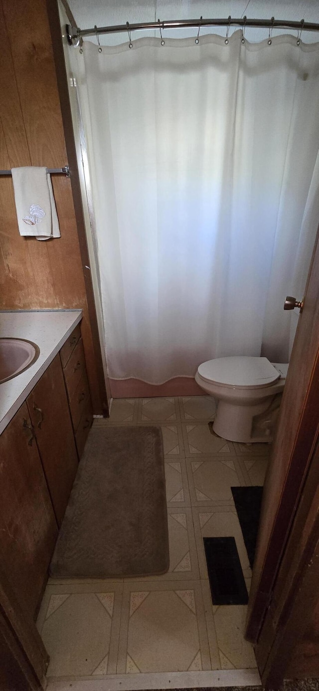 22684 Forest Ln, Hermitage, MO 65668 - full bathroom featuring vanity, toilet, a shower, and tile patterned floors