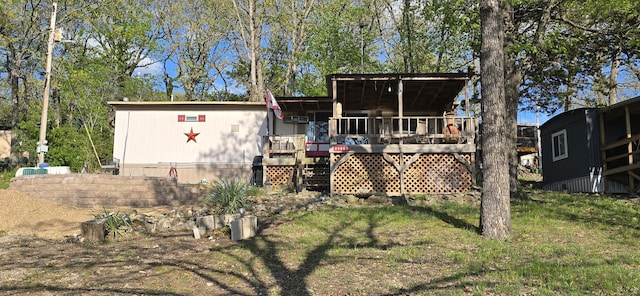 25965 Willow Rd, Hermitage, MO 65668 - rear view of house featuring a lawn and a deck