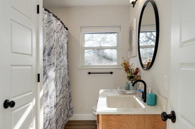 9247 State Highway 13, Kimberling City, MO 65686 - full bathroom with vanity, wood finished floors, toilet, baseboards, and a shower with curtain
