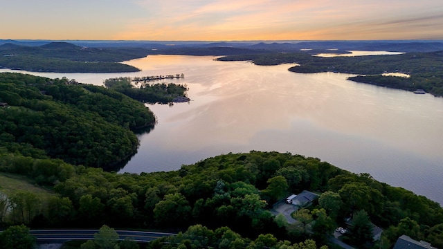 9247 State Highway 13, Kimberling City, MO 65686 - aerial view at dusk featuring a water view and a forest view