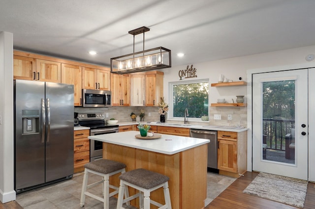 9247 State Highway 13, Kimberling City, MO 65686 - kitchen with a sink, light countertops, decorative backsplash, and stainless steel appliances