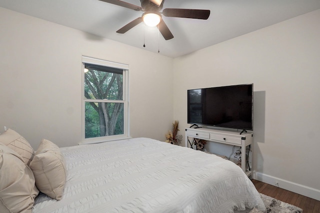 9247 State Highway 13, Kimberling City, MO 65686 - bedroom featuring baseboards, a ceiling fan, and wood finished floors