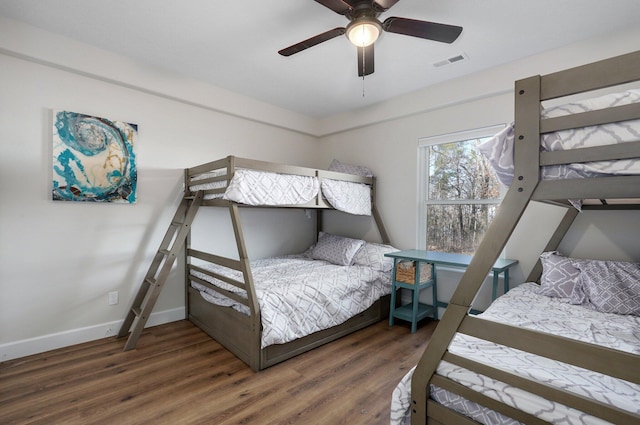 9247 State Highway 13, Kimberling City, MO 65686 - bedroom featuring visible vents, baseboards, ceiling fan, and wood finished floors