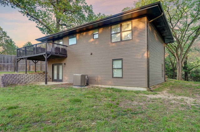 9247 State Highway 13, Kimberling City, MO 65686 - back of property featuring central AC unit, a yard, and a deck
